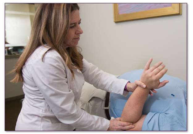 Image of Dr. Stanley treating an elbow issue.