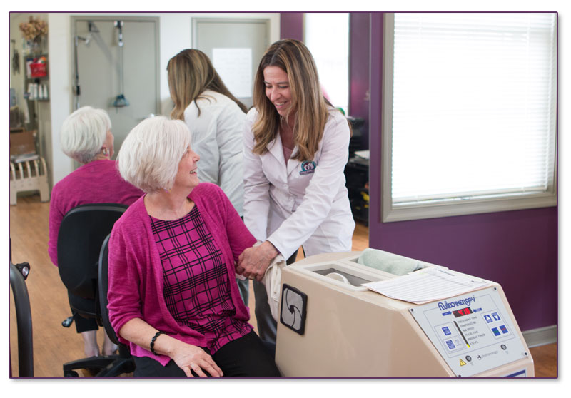  Linda Stanley, assisting one of the patients 